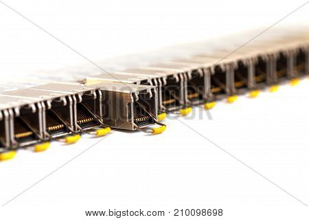 Row of Internet SFP (Small Form-factor Pluggable) network modules for network switch. Close up. Isolated.
