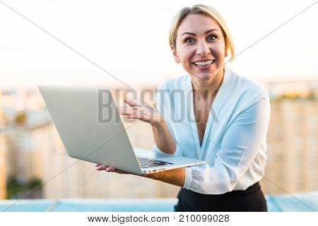 Beautiful Smart Business Lady Stand On The Roof With Laptop In Hands