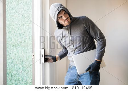 Man Stealing Stuff From A House