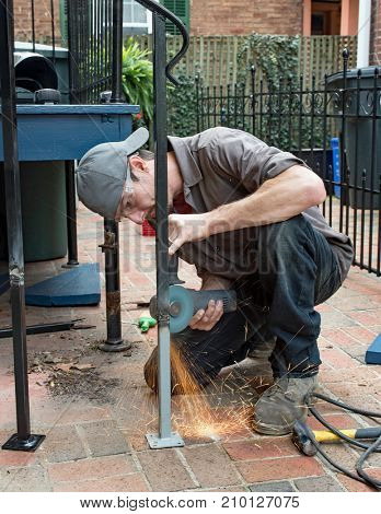 Worker Grinding Weld