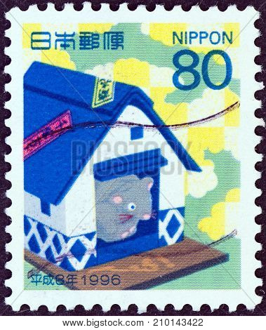 JAPAN - CIRCA 1995: A stamp printed in Japan shows mouse in a rice barn (Year of the Rat, 1996), circa 1995.