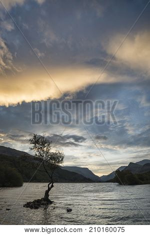Beautiful Landscape Image Of Llyn Padarn At Sunrise In Autumn In Snowfonia National Park