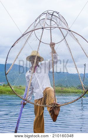 INLE LAKE MYANMAR - SEP 07 : Burmese fisherman at Inle lake Myanmar on September 07 2017 inle Lake is a freshwater lake located in Shan state