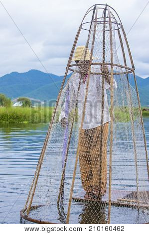 INLE LAKE MYANMAR - SEP 07 : Burmese fisherman at Inle lake Myanmar on September 07 2017 inle Lake is a freshwater lake located in Shan state