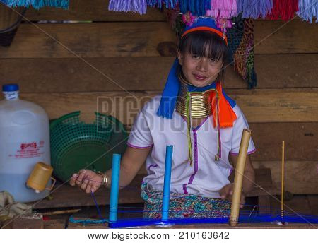 KAYAN STATE MYANMAR - SEP 09 : Portrait of a Kayan tribe woman in Kayan state Myanmar on September 09 2017 Kayan tribe woman are well known for wearing neck rings.