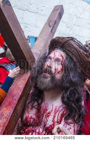 JERUSALEM - APRIL 14 : Christian pilgrim re-enact the crucifixtion of Jesus along the Via Dolorosa in Jerusalem during Good friday on April 14 2017