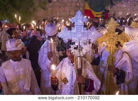 JERUSALEM - APRIL 15 : Ethiopian Orthodox pilgrims participates in the Holy fire ceremony at the Ethiopian section of the Holy Sepulcher in Jerusalm Israel on April 15 2017
