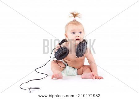 Cute Cheerful Little Girl In Diaper And With Headphones