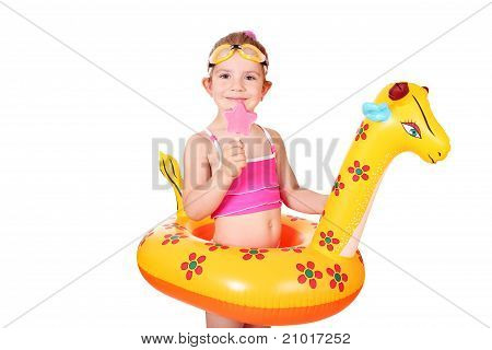 little girl with ice cream and swimming rubber