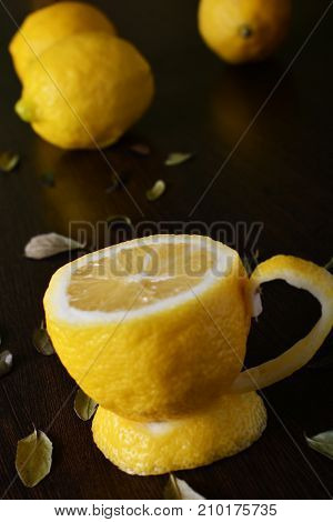 A cup of lemona cup of lemon on a wooden table