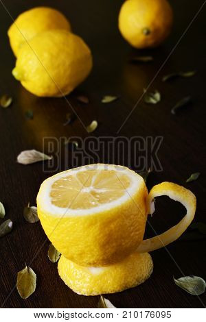 A cup of lemona cup of lemon on a wooden table