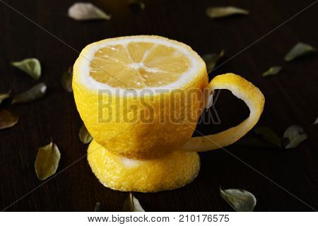A cup of lemona cup of lemon on a wooden table