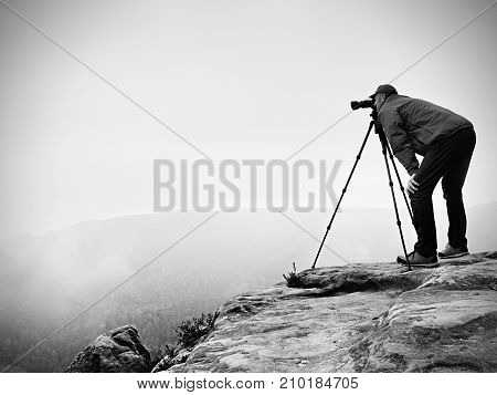 Wildlife Photographer On Mountain Summit Works. Man Like To Travel And Photography, Taking Pictures
