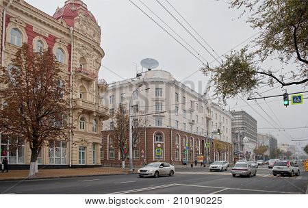 Rostov-on-DonRussia - October 212017: The street Bolshaya Sadovaya misty autumn.Workers reconstruct the pavement. On the street cars and pedestrians move