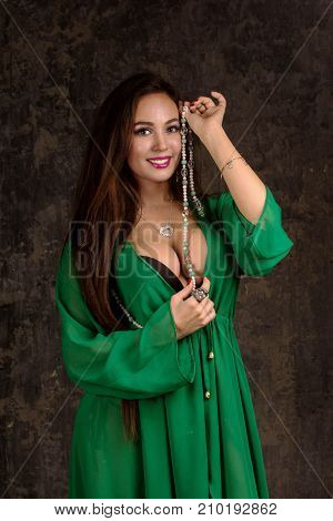 Beautiful Woman In Green Abaya.