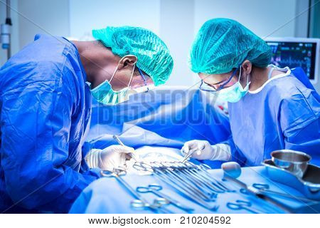 Surgical team performing surgery operation. Doctor performing surgery .