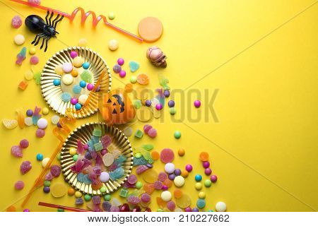 halloween candy with decoration colorful on yellow ground