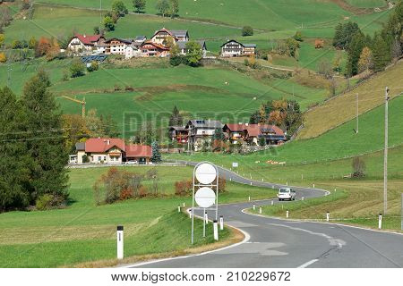 Winding road through the village of Rennweg am Katschberg, located in the Katsch Valley (Katschtal) in the Alps mountains. Carinthia, Austria.