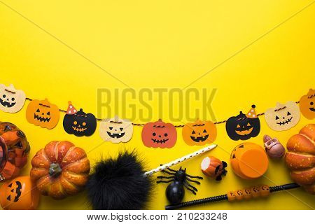 top view of halloween paper hanging with candy