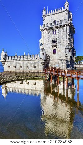 Belem Tower Torre de Belem Portuguese Symbol of Exploration Reflection Lisbon Portugal. Belem Tower was constructed in early 1500s on Tagus River and last point Portguese explorers saw when left Lisbon.