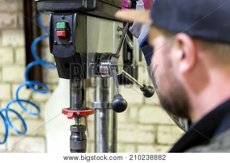 Experienced operator. Metalworking industry concept professional engineer metalworker operating milling machine center in tool manufacturing workshop