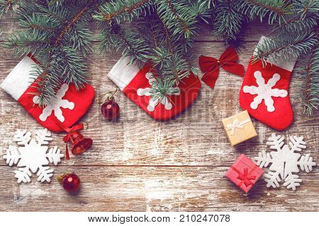 Christmas decorations on old boards. Christmas background. Christmas Socks. New Year background. Xmax background. Christmas tree. Toned image.