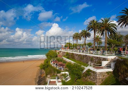 Santander Spain - July 1 2017: El Sardinero waterfront promenade and surfer beach. El Sardinero is a popular beach located in the Spanish city of Santander Cantabria