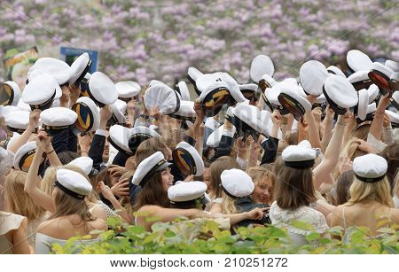 STOCKHOLM SWEDEN - JUN 13 2017: Smiling graduating students beautiful llilac bush in the background at the dance school Balettakademien June 13 2017StockholmSweden