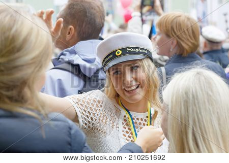 STOCKHOLM SWEDEN - JUN 13 2017: Beautiful smiling blonde students girl preparing to hug the family at the dance school Balettakademien June 13 2017StockholmSweden