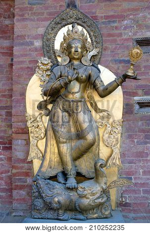 PATAN, NEPAL - JANUARY 22, 2017: Ancient statue of goddess Ganga in Royal Palace at Mul Chowk in Patan, Kathmandu Valley, Nepal