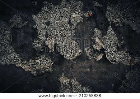 Black wall background. Grunge texture with stone and old iron parts