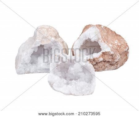Collection of clear crystal quartz geodes with crystalline druzy center isolated on white background