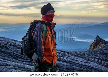 Laban Rata,Sabah,Borneo-March 12,2016:Adventure climber standing near of Mount Kinabalu's summit Low's Peak during sunrise at Ranau,Sabah Borneo,Malaysia.