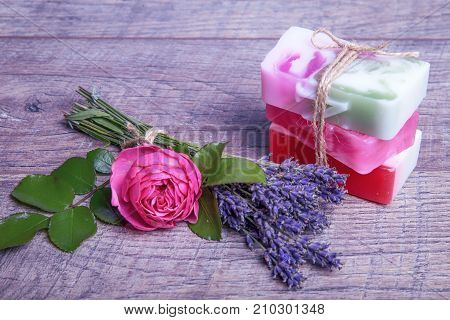 Handmade Soap with bath and spa accessories. Dried lavender and nostalgic pink rose. Spa background