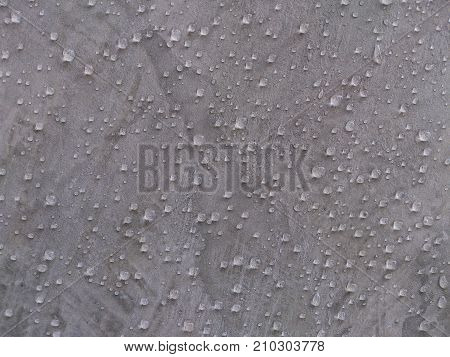 The wall is polished and beautiful in front of the wall in the background.
