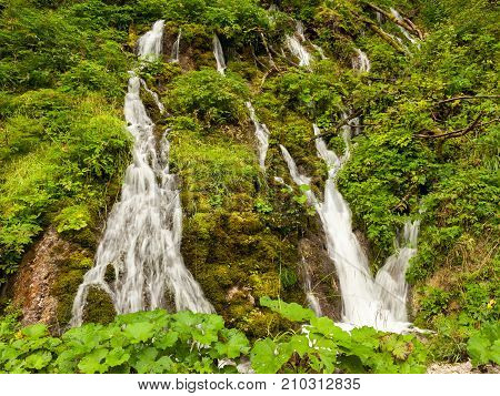 A small waterfall in the forest in the Austrian alps (Salzkammergut)