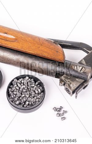 Box With Metal Air Gun Pellets And Air Gun With Wooden Kundak Gunstock Above White Background