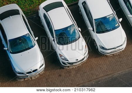 Three cars in the parking lot - bmv Mazda Volkswagen. Russia. Moscow October 19