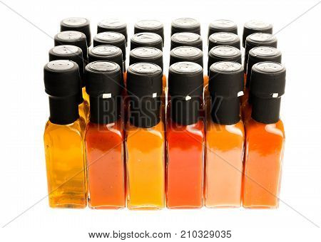 Set Of Hot Chili Sauce Glass Bottles On White Background.