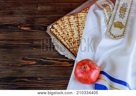 White Plate With Matzah Or Matza And Passover Haggadah On A Vintage Wood