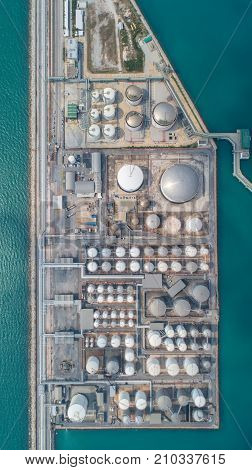 Aerial view Oil refinery.Industrial view at oil refinery plant form industry zone with sunrise and cloudy sky.Oil refinery and Petrochemical plant at duskThailand. Oil refinery background sunset.