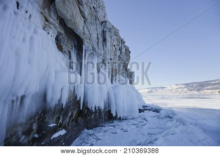 Icicles In Ogoi Island Rock. Winter Landscape