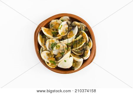 Clams with marinera sauce.Almejas a la marinera. Spanish recipe isolated on white background.Top view