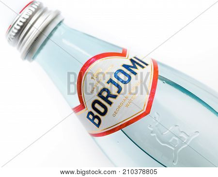 MOSCOW, RUSSIA - OCTOBER 23, 2017: Glass bottle of natural mineral water Borjomi isolated on white. Macro shot, Shallow DOF. Borjomi is one of the most famous products of Georgia.
