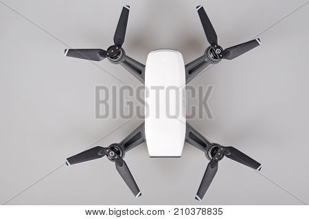 Remote Control Air Drone with action camera on grey background