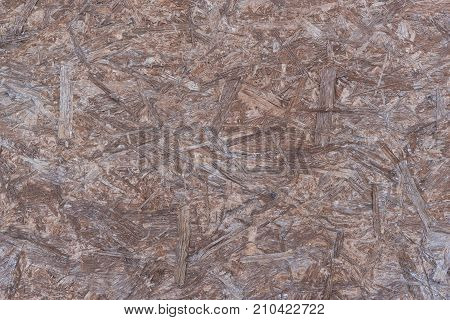 The texture of the chipboard brown color