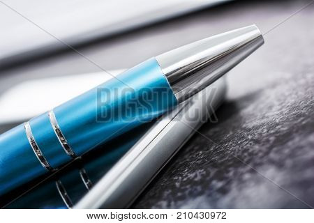 Blue Pencil Lying On A White Smartphone On Slate