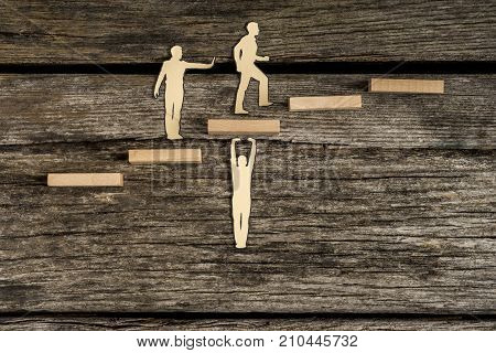 Teamwork Concept Using Cut Outs Of Paper Men