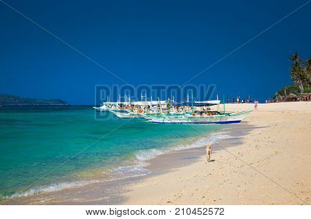 Traditional boat that do a island hopping in the beautiful Puka Beach at Boracay. Philippines