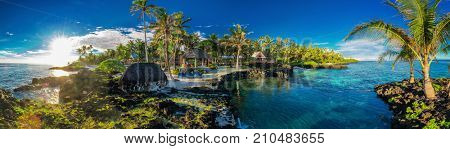 Panoramic paradise holoidays location with coral reef and palm trees on south side of Upolu, Samoa Islands.
